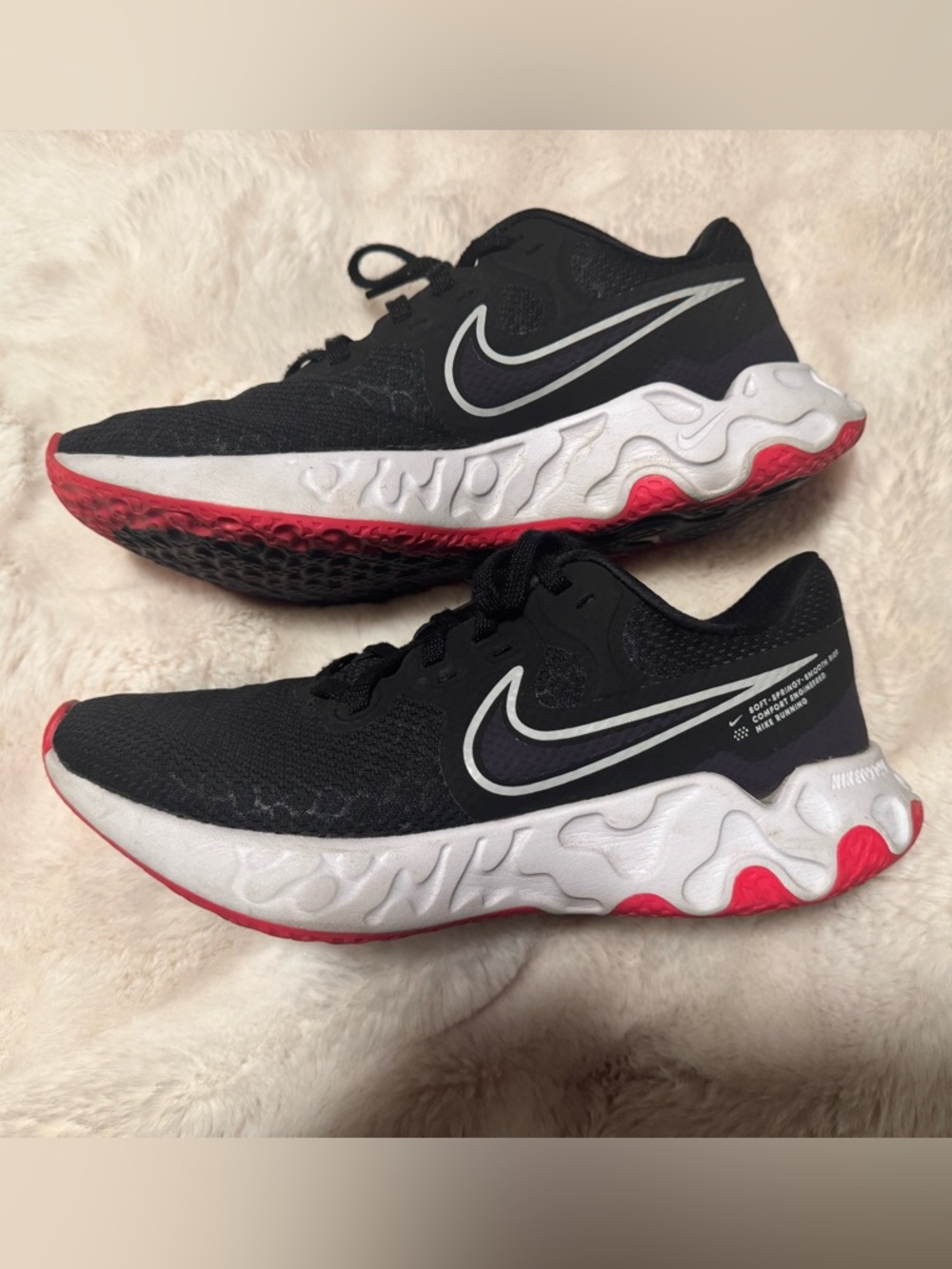 Nike Black Running Shoes with White Swoosh and Pink-Red Accents
